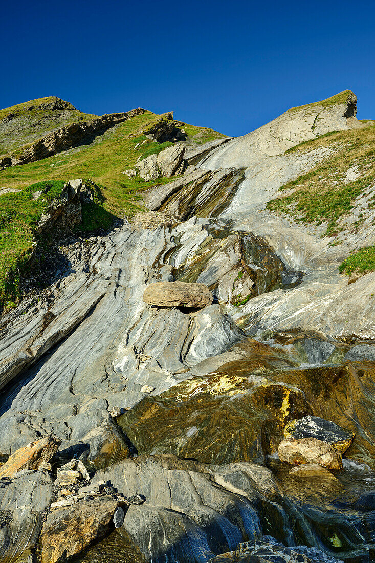  Stream flowing in banded rock bed, at Col des Fours, Tour du Mont Blanc, Mont Blanc Group, Graian Alps, Haute-Savoie, Upper Savoy, France 