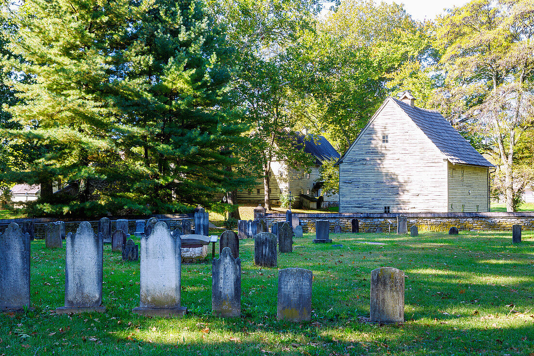 Ephrata Cloister with God's Acre Cemetery with grave of Conrad Beissel and view of The Weaver's Workshop in Ephrata in Pennsylvania Dutch Country, Lancaster County, Pennsylvania, USA