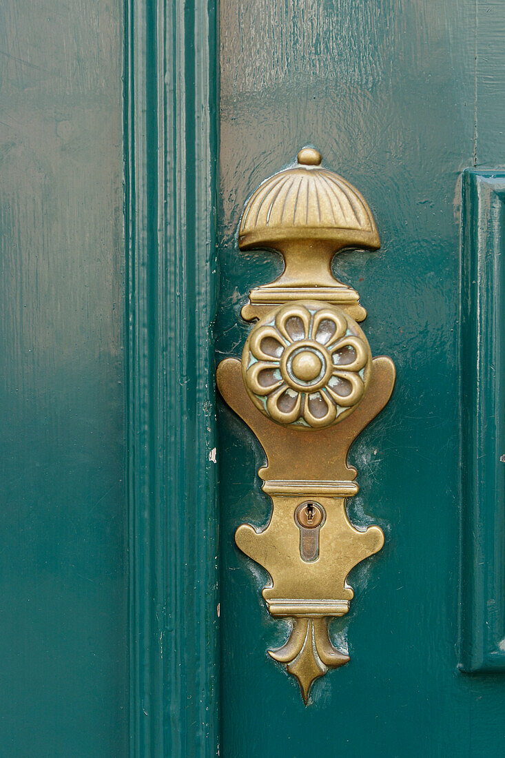  Bronze handle on old front door 