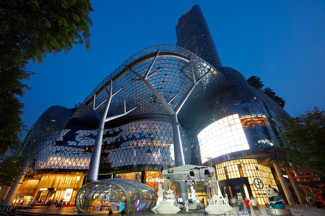 Exterior view of the ION Orchard shopping mall illuminated at night. Orchard Road, Singapore.