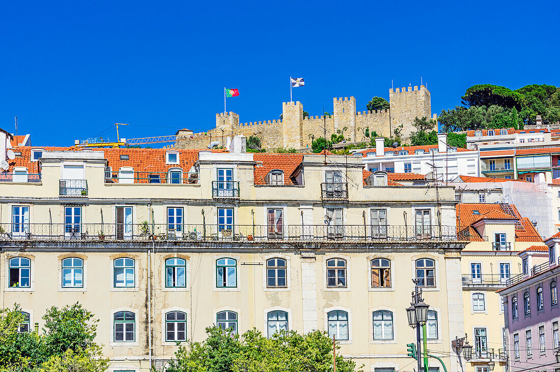  City views of streets in Lisbon near the Estatua Equestre de Dom Joao I with view of the Castelo de Jorge, Portugal 