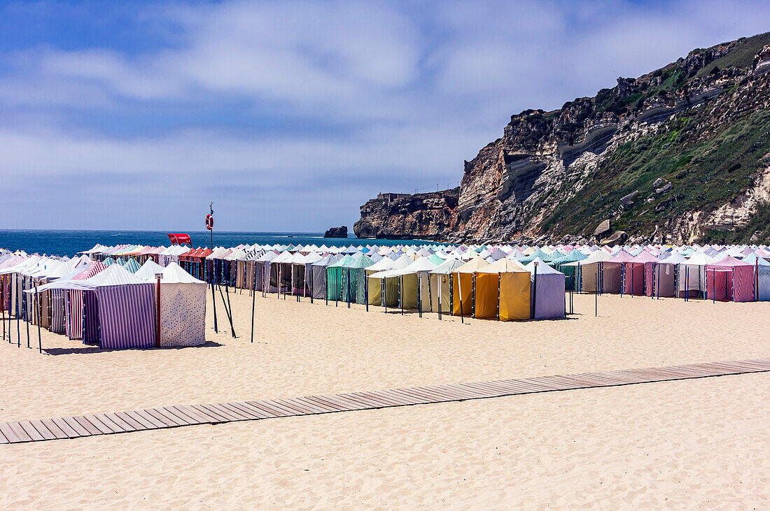  Nazaré is a Portuguese city on the Atlantic Ocean in the Oeste subregion of the Centro region and the historical province of Estremadura, about 100 km north of Lisbon, here colorful beach tents. 