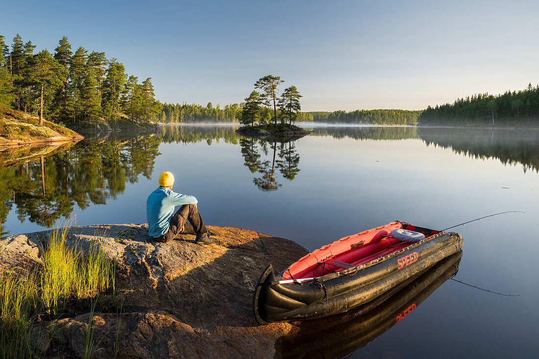  a man with a canoe in Glaskogen Nature Reserve, Värmland County, Sweden 