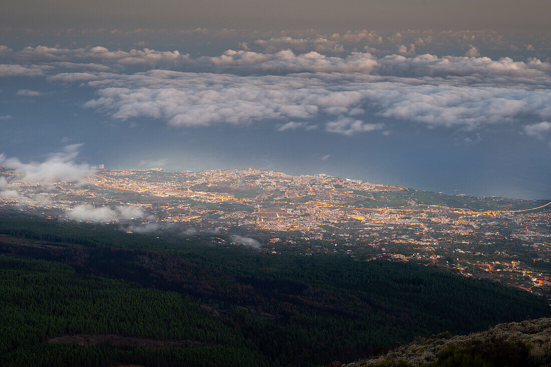  Nighttime view from Teide National Park, Parque Nacional del Teide, to the illuminated Orotava, Puerto de la Cruz and trade wind clouds over the Atlantic Ocean, Tenerife, Canary Islands, Spain, Europe 