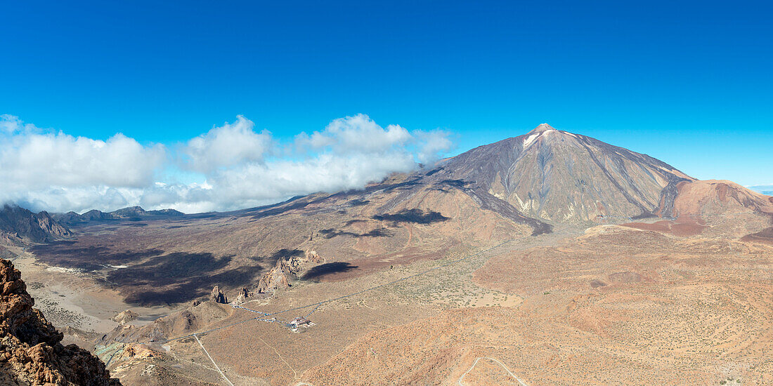  Panorama during the ascent to the Alto de Guajara, 2715m, to the bizarrely shaped rock formations made of volcanic rock, Roques de García, the visitor center and the Hotel Parador, behind it the Pico del Teide, 3717m, Teide National Park, Parque Nacional del Teide, Tenerife, Canary Islands, Spain, Europe 