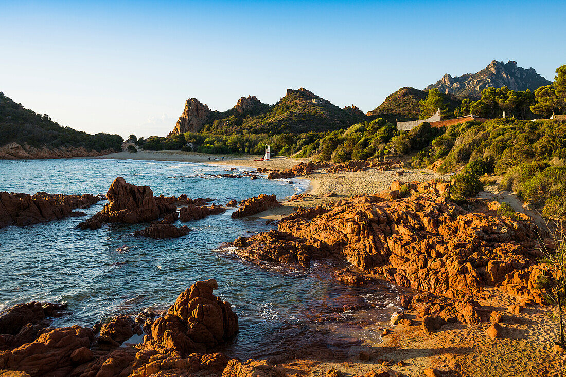  Lonely picturesque beach and red rocks, Spiaggia Su Sirboni, sunrise, near Tertenia, Ogliastra province, Sardinia, Italy 