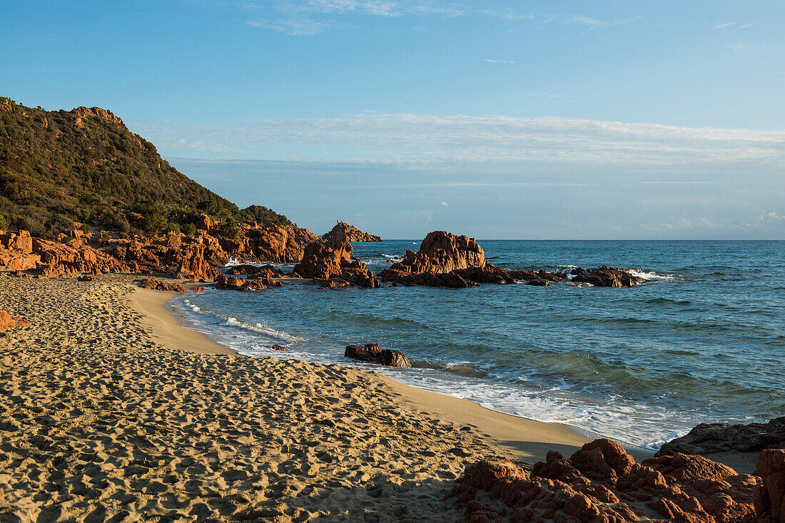  Lonely picturesque beach and red rocks, Spiaggia Su Sirboni, sunrise, near Tertenia, Ogliastra province, Sardinia, Italy 