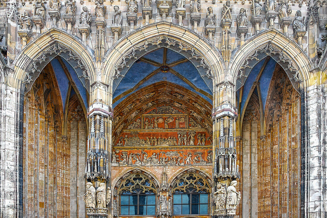  Detail. Main portal of the Ulm Minster, with columns, figures and tympanum. Ulm, Baden-Württemberg, Germany, Europe\n\n 