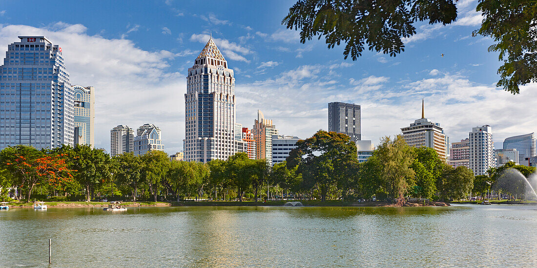 Panoramic view of modern high-rise buildings at Lumphini Park in Bangkok, Thailand.