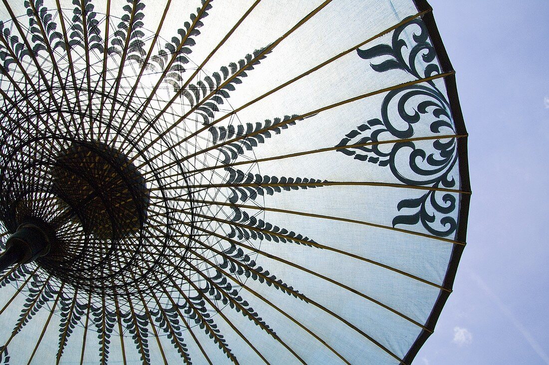 An open sunshade with an oriental pattern