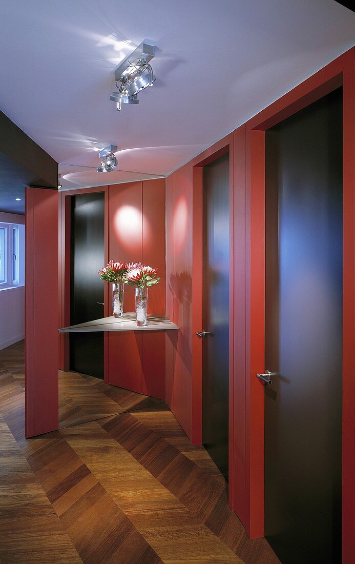 An anteroom with red wood panelling on the wall