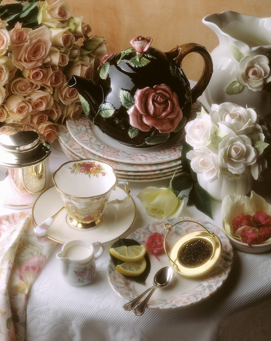 Tea party; rose-patterned teapot and plate