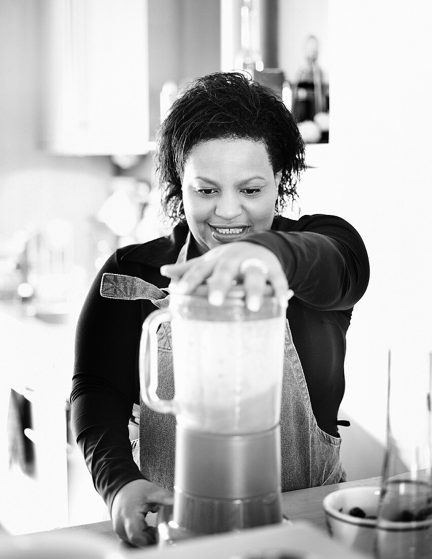 Young woman with a liquidiser