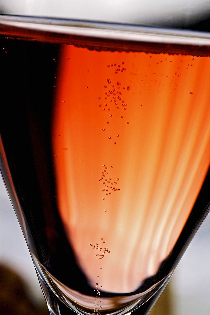 A glass of rosé champagne (close-up)