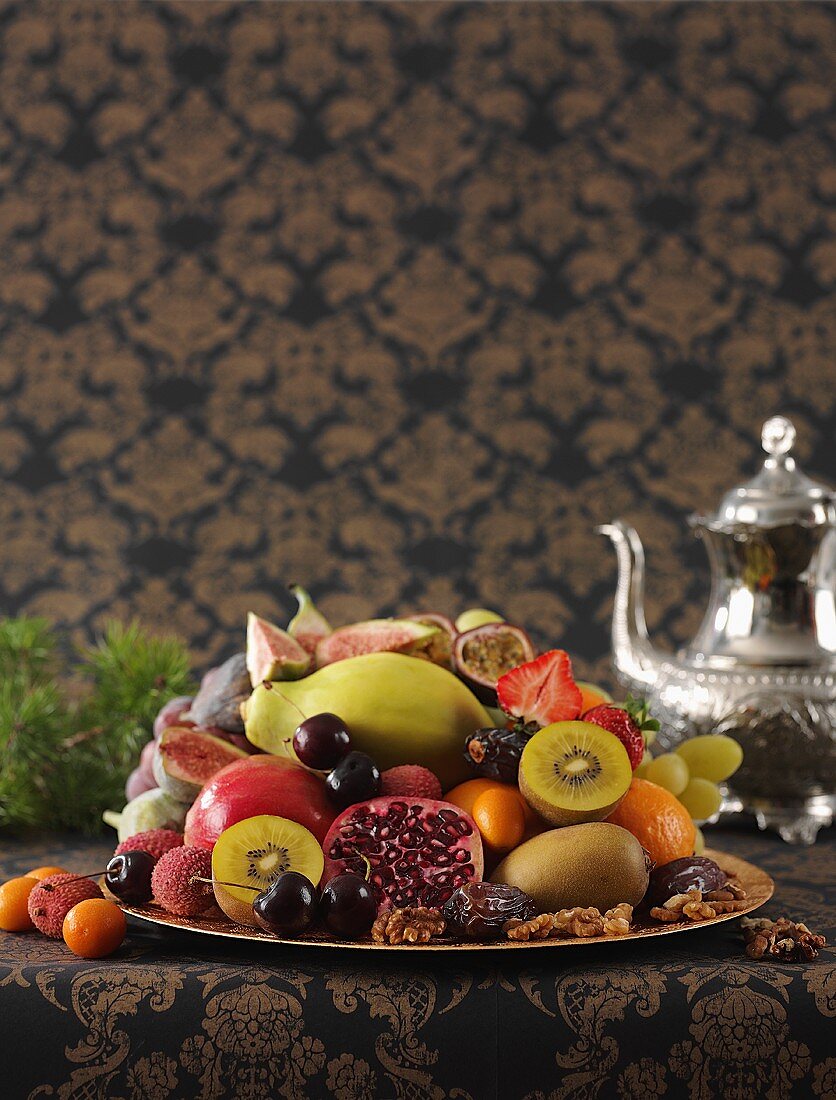 Plate of fruit and silver teapot (Middle Eastern)