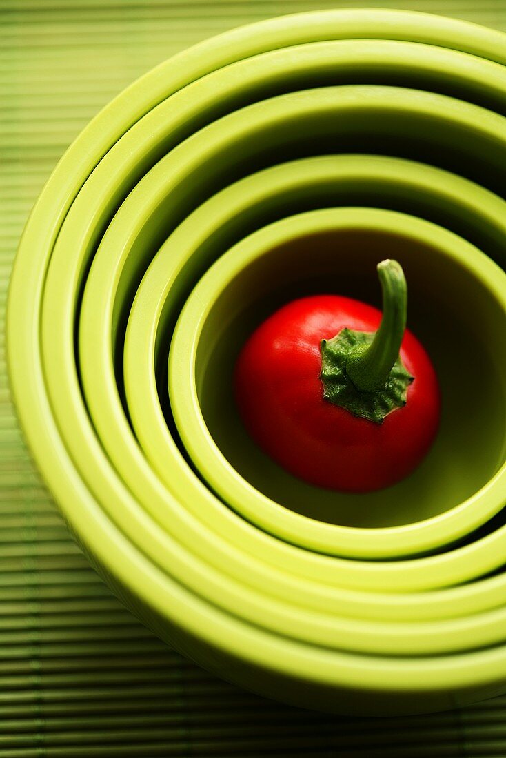 Cherry pepper in nested green bowls