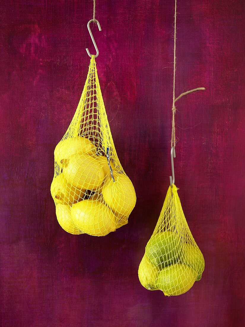 Lemons in net bags (hanging up)