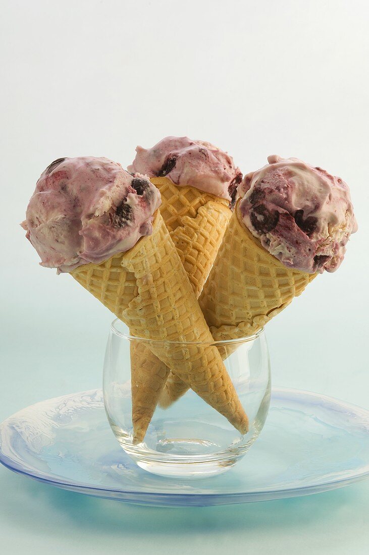 Three cones of blueberry ice cream