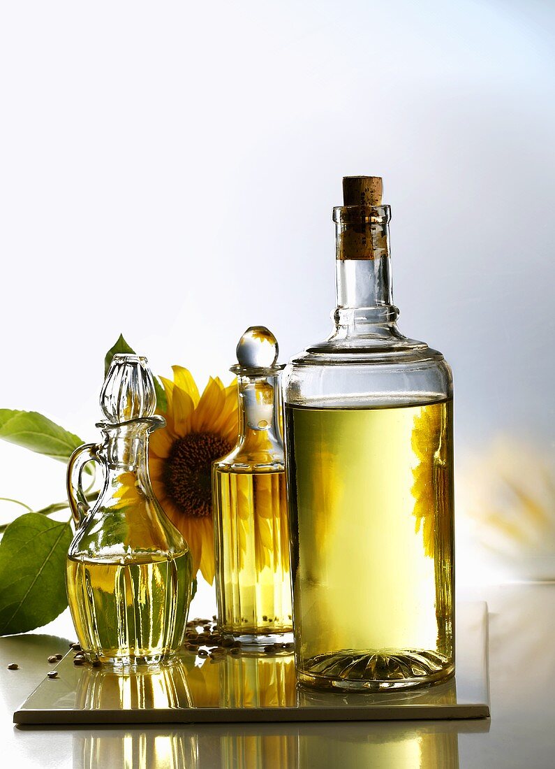 Sunflower oil in three different bottles