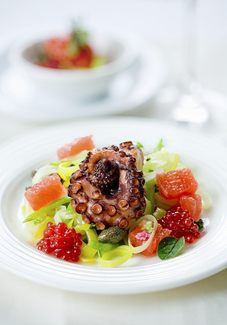 Grilled octopus on fruit salad