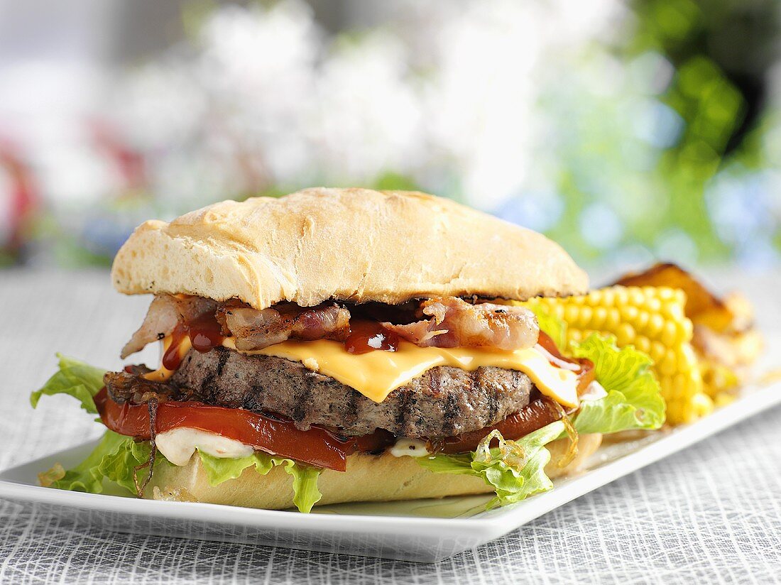 Cheeseburger with bacon and sweetcorn