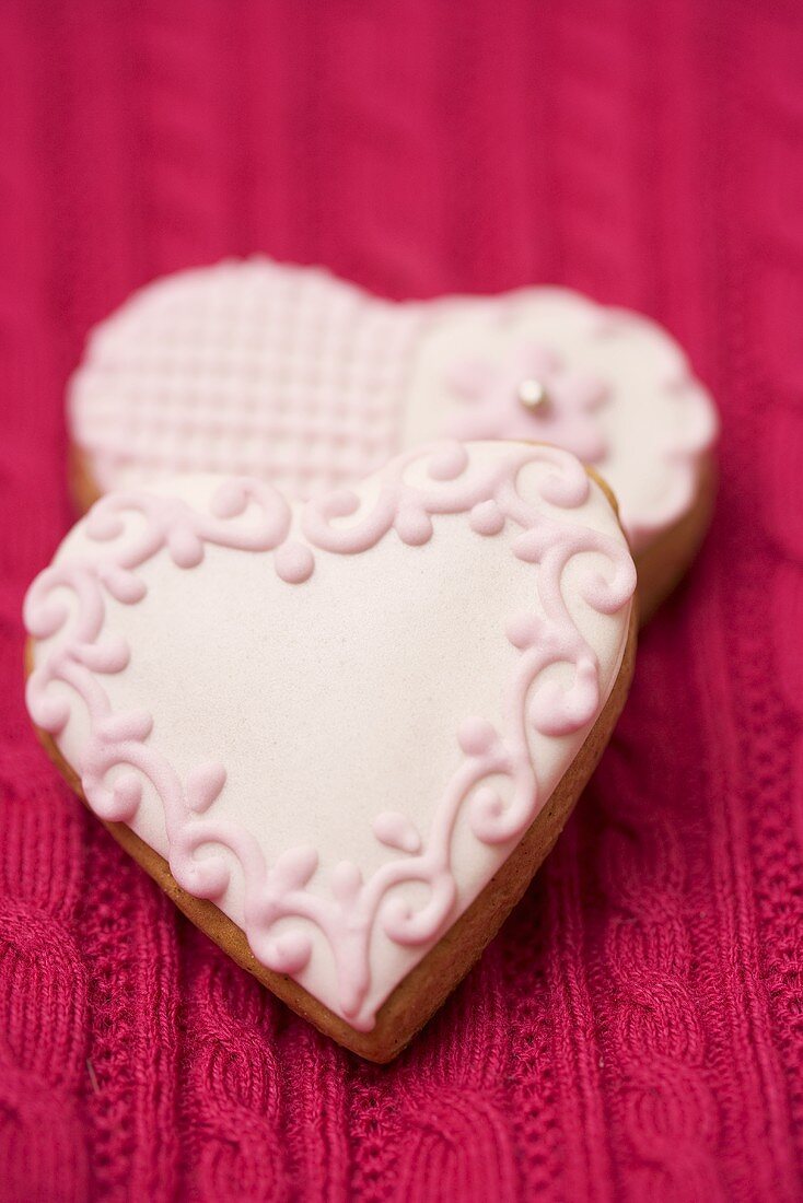 Two pink heart-shaped biscuits