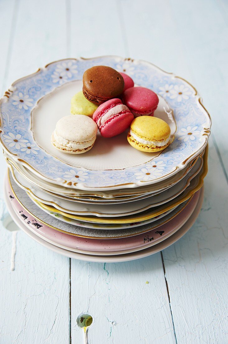 Colourful macaroons on a stack of plates