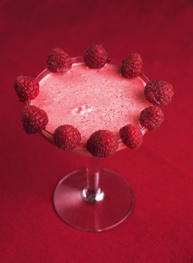 Raspberry milk shake in a martini glass