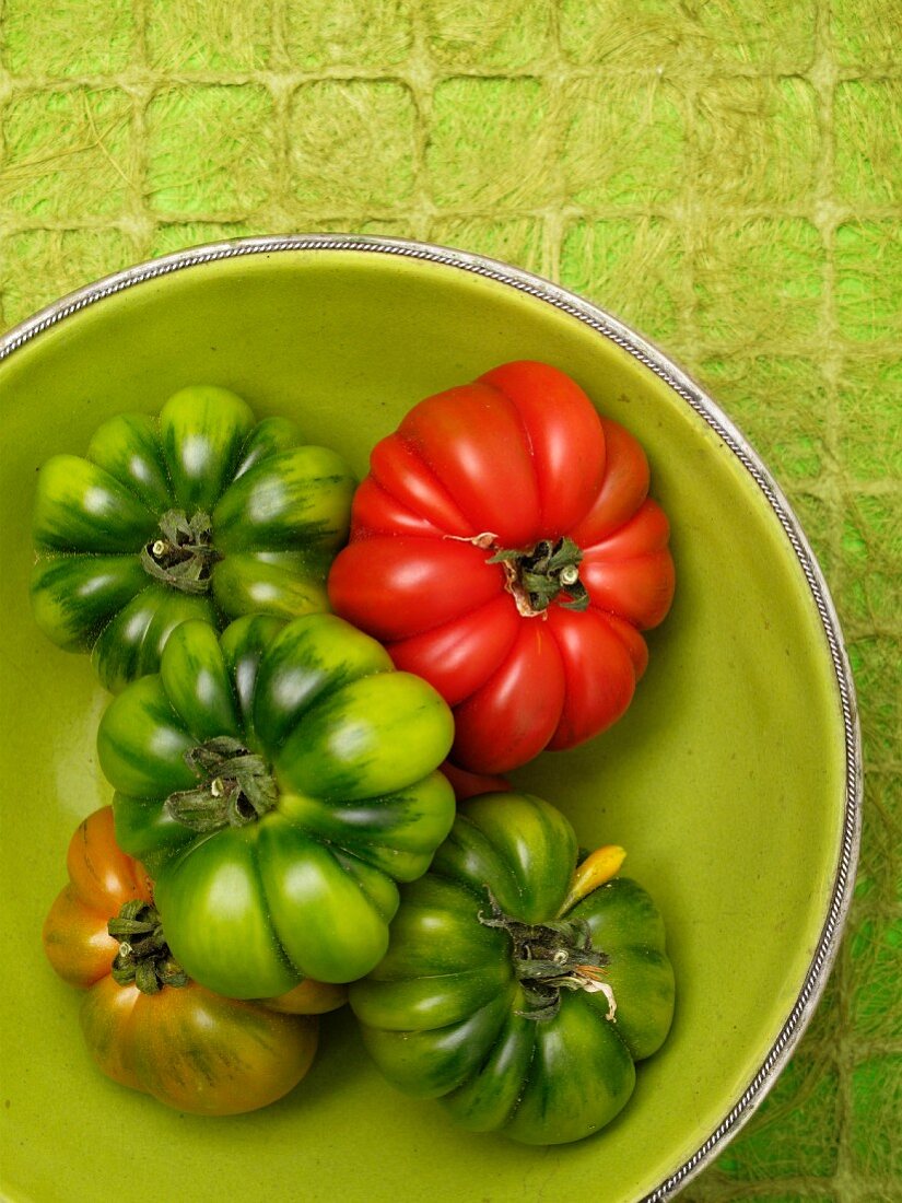 Tomatoes in a green bowl