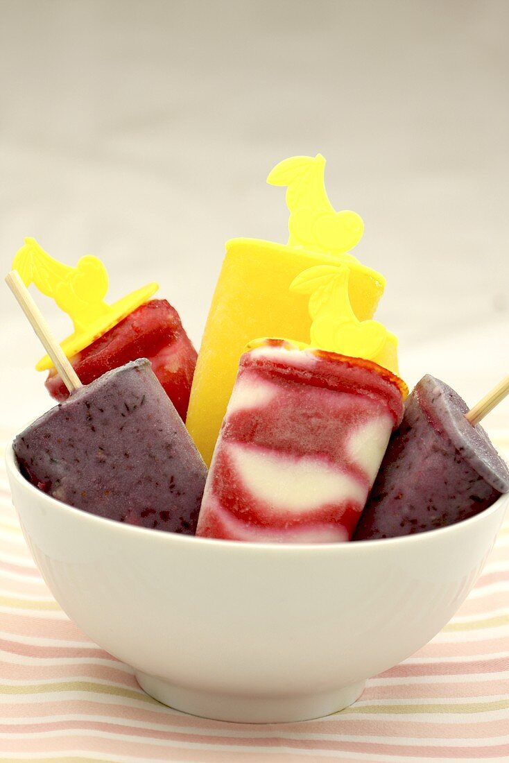 Mango, orange, vanilla and raspberry ice lollies