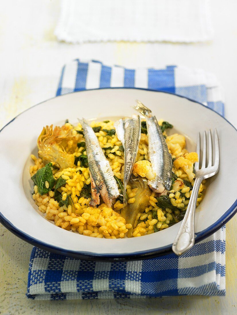Rice with sardines, spinach, artichokes and cauliflower (Spain)