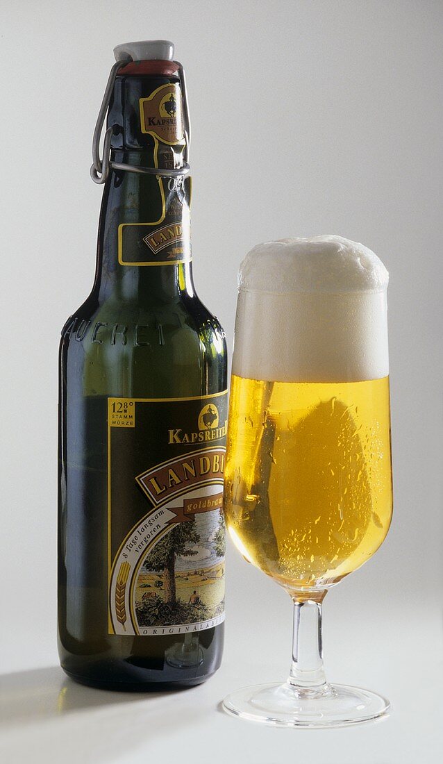 A glass of Pils and bottle from Austria