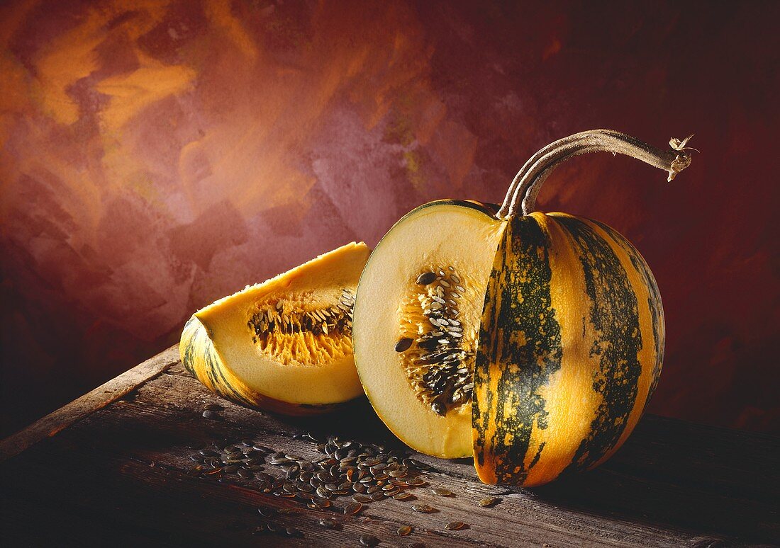 Pumpkin or Squash; Quartered on a Wooden Table