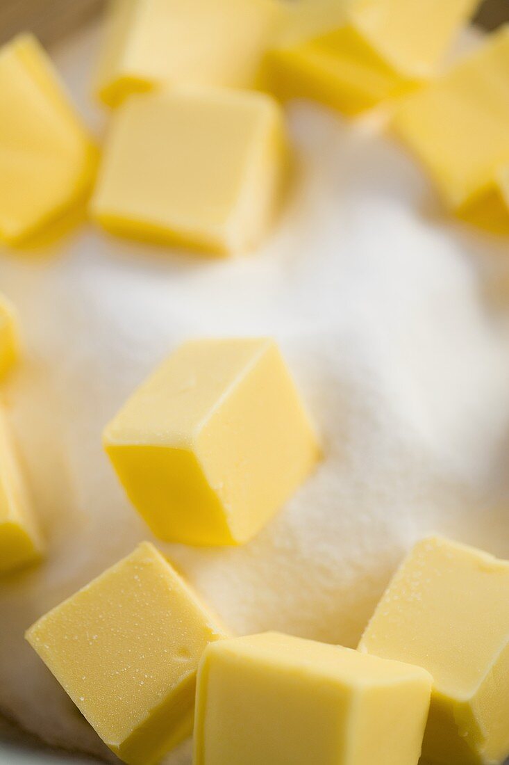 Several butter cubes with sugar