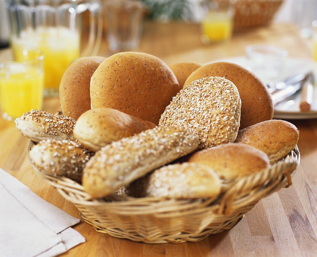 Assorted wholemeal rolls in bread basket