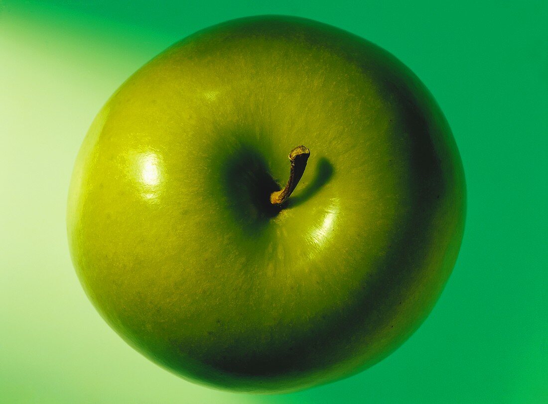 A green apple (Granny Smith) from above