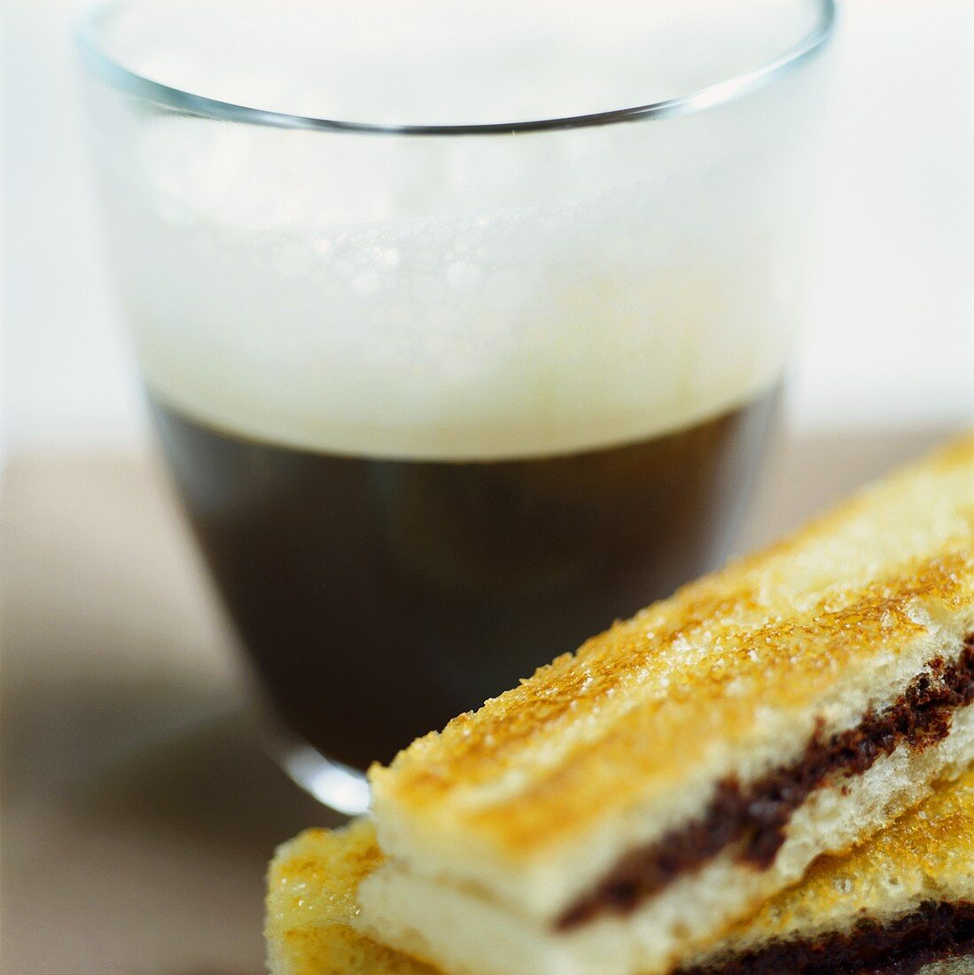 Espresso macchiato and cinnamon toast with chocolate cream