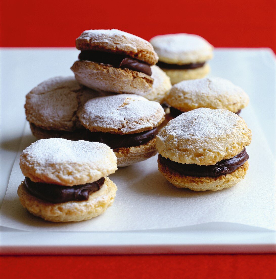 Macaroons with chocolate cream and icing sugar