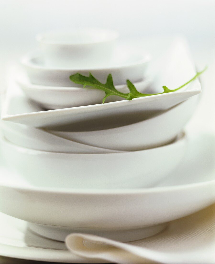 White crockery, decorated with rocket leaf