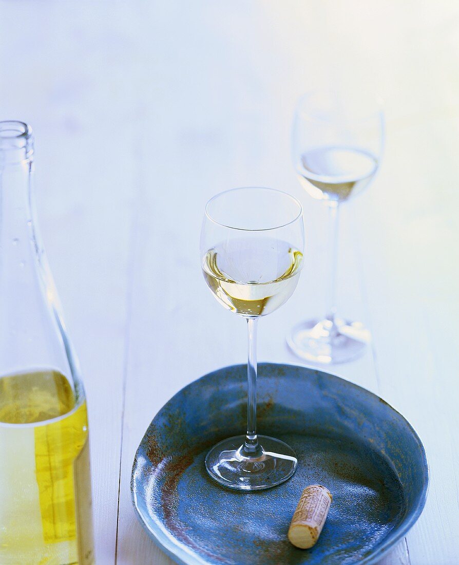 Bottle of white wine and two glasses
