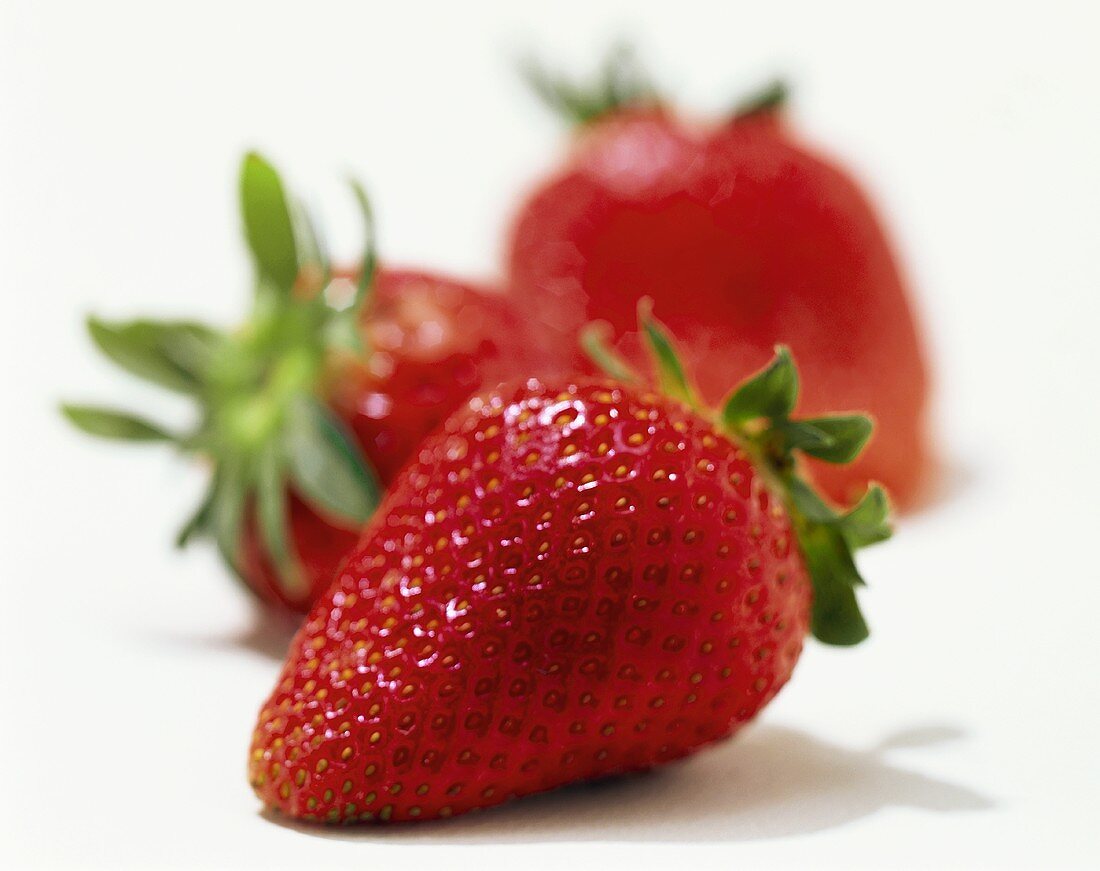 Three ripe strawberries