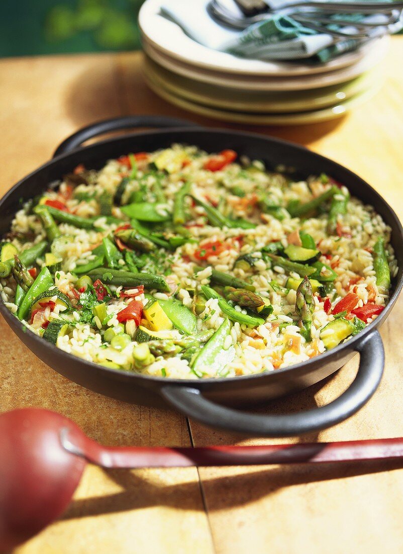 Vegetable paella with Serrano ham