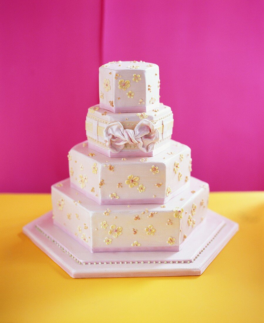 Four-tiered pink wedding cake