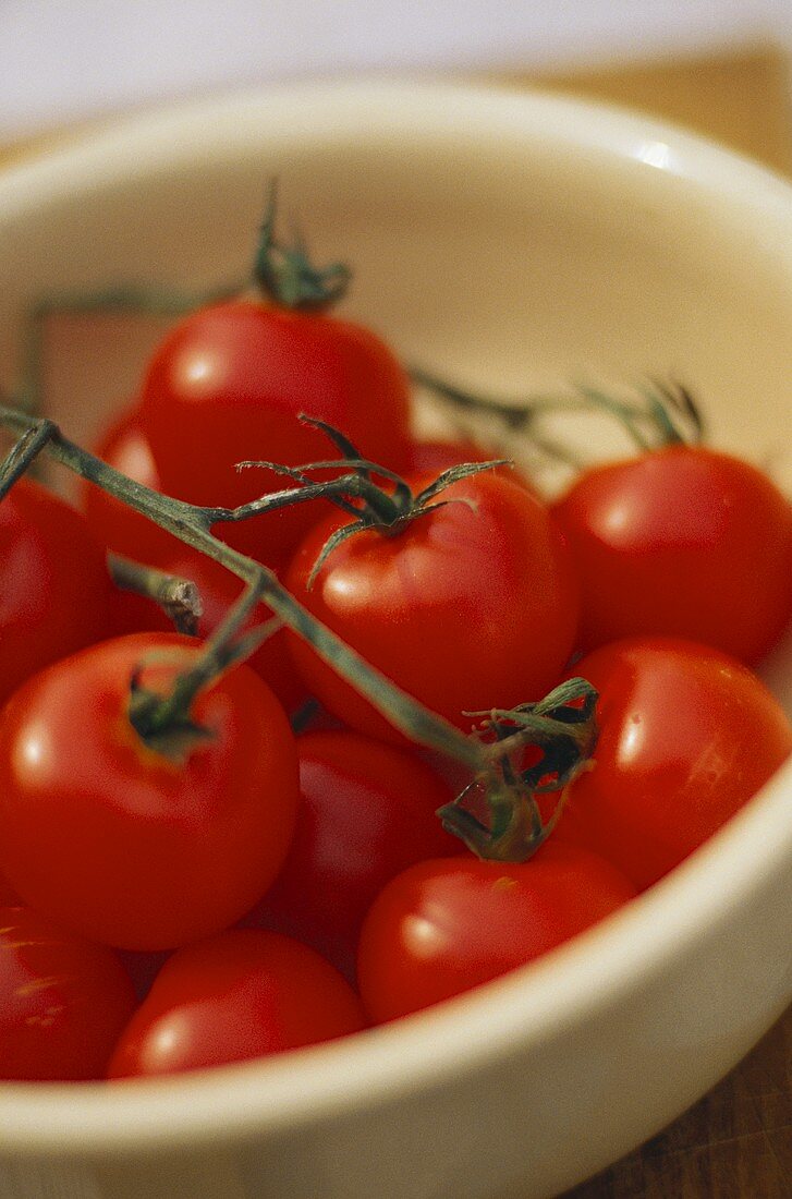 Vine tomatoes in white bowl