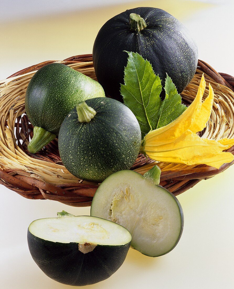 Round courgettes (variety: Eight ball, F1 hybrid) in basket