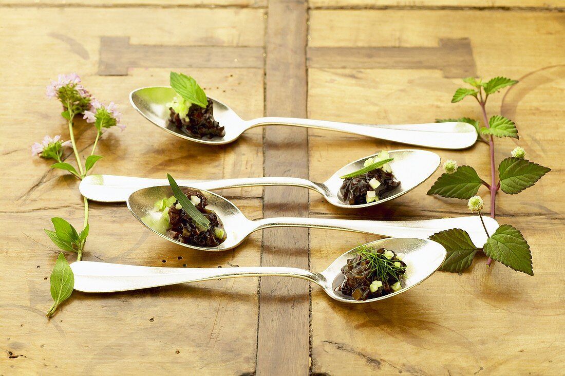 Lamb kidneys with balsamic vinegar and celery on spoons