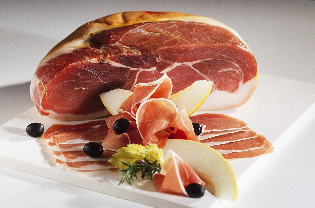 Parma ham with honeydew melon and olives