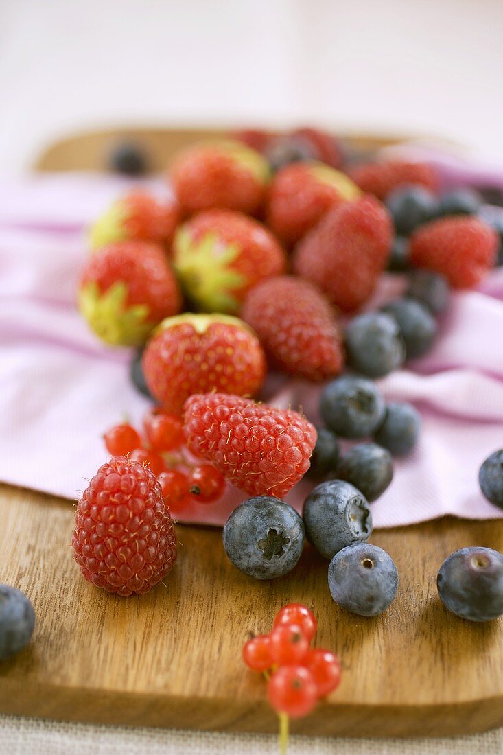 Mixed berries on chopping board