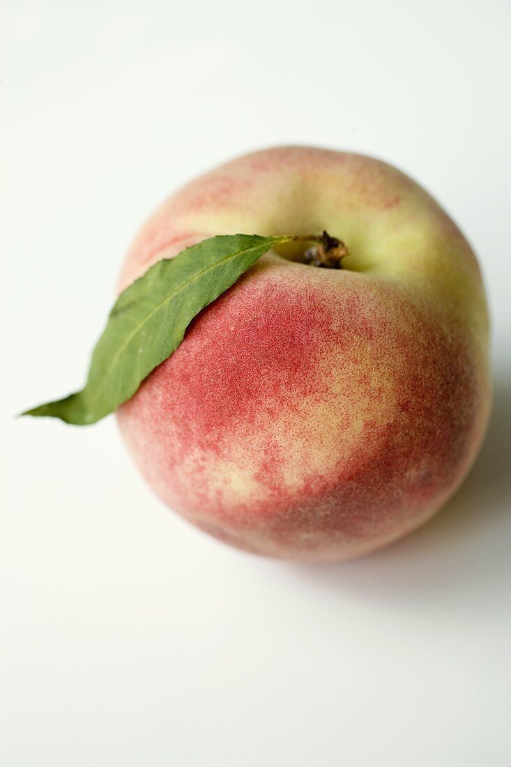 Fresh peach with leaf