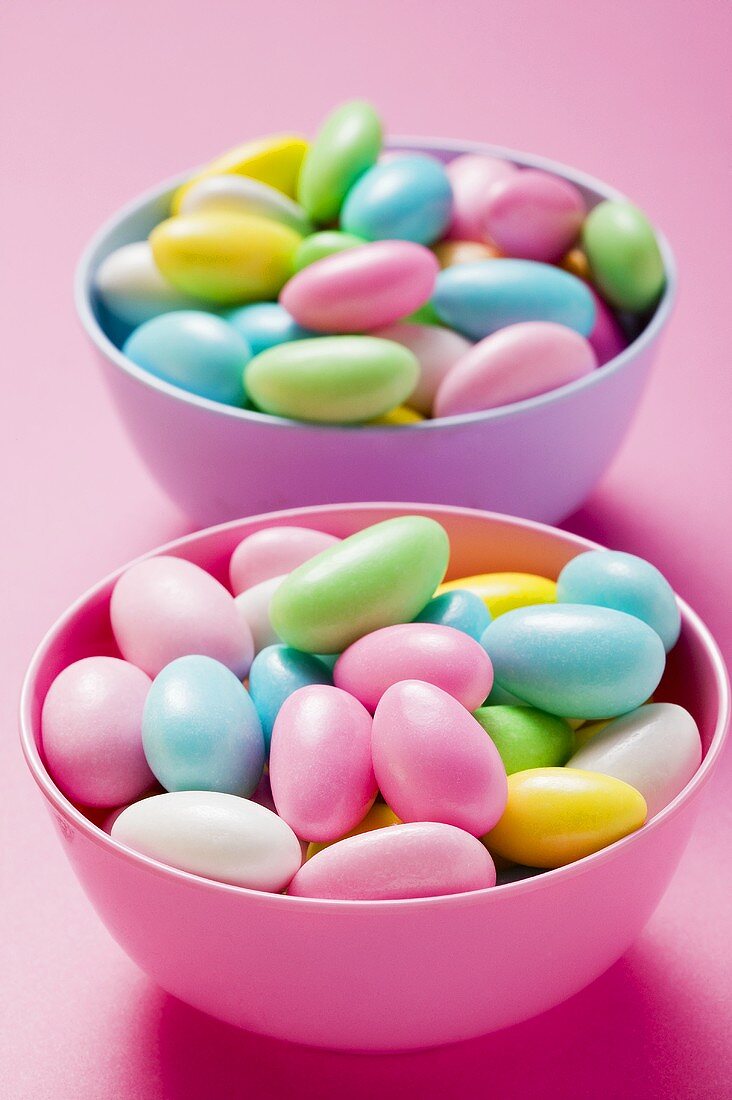 Coloured sugared almonds in two bowls